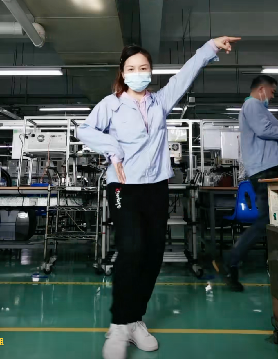 TRP Connector Worker Yi performs a dance on the factory floor
