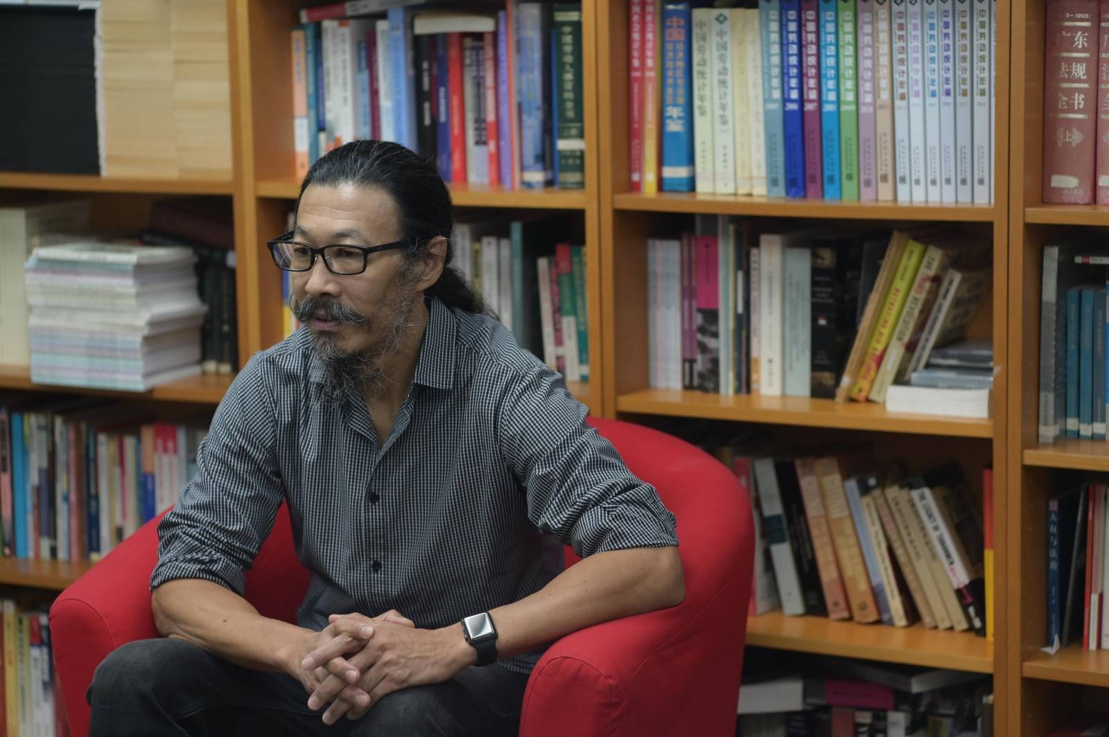 CLB Executive Director Han Dongfang sits in the CLB office in October 2021