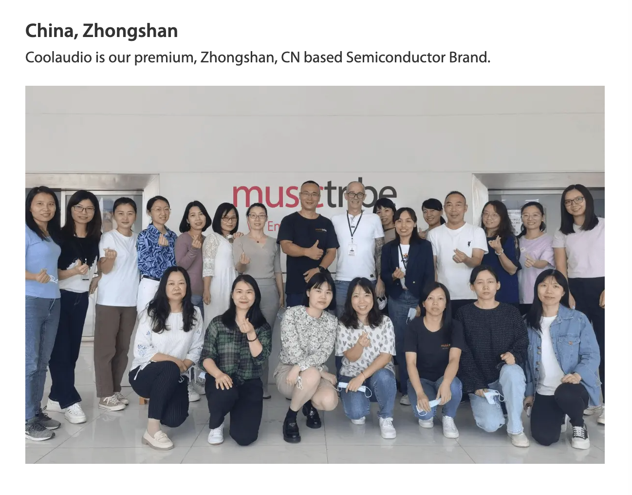 A screenshot from the Music Tribe website shows workers in Zhongshan posing for a photo
