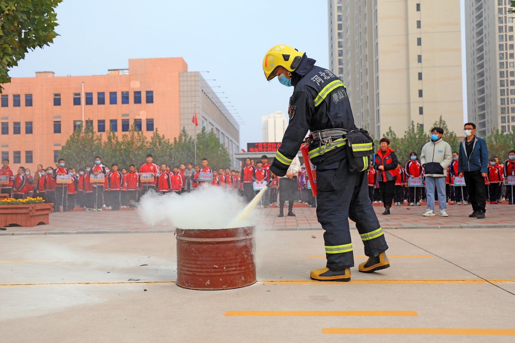 A firefighter extinguishes a fire during a demonstration