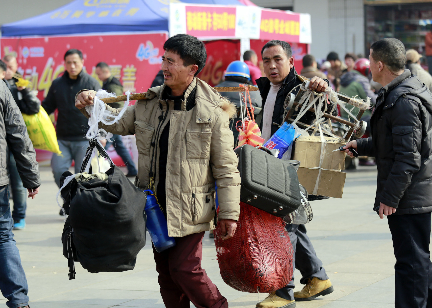 Migrant workers at a train station in China