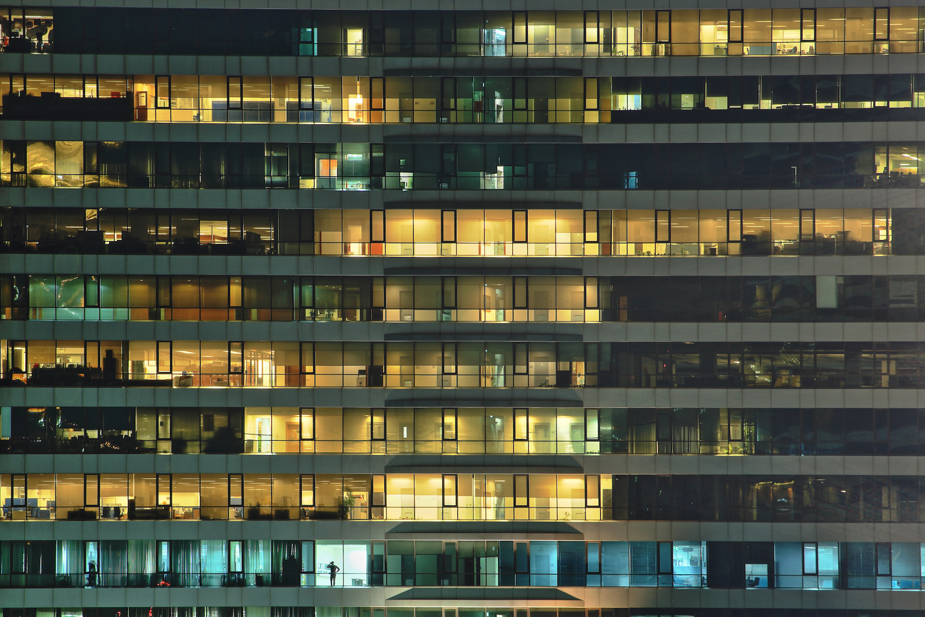 An office building is lit up at night